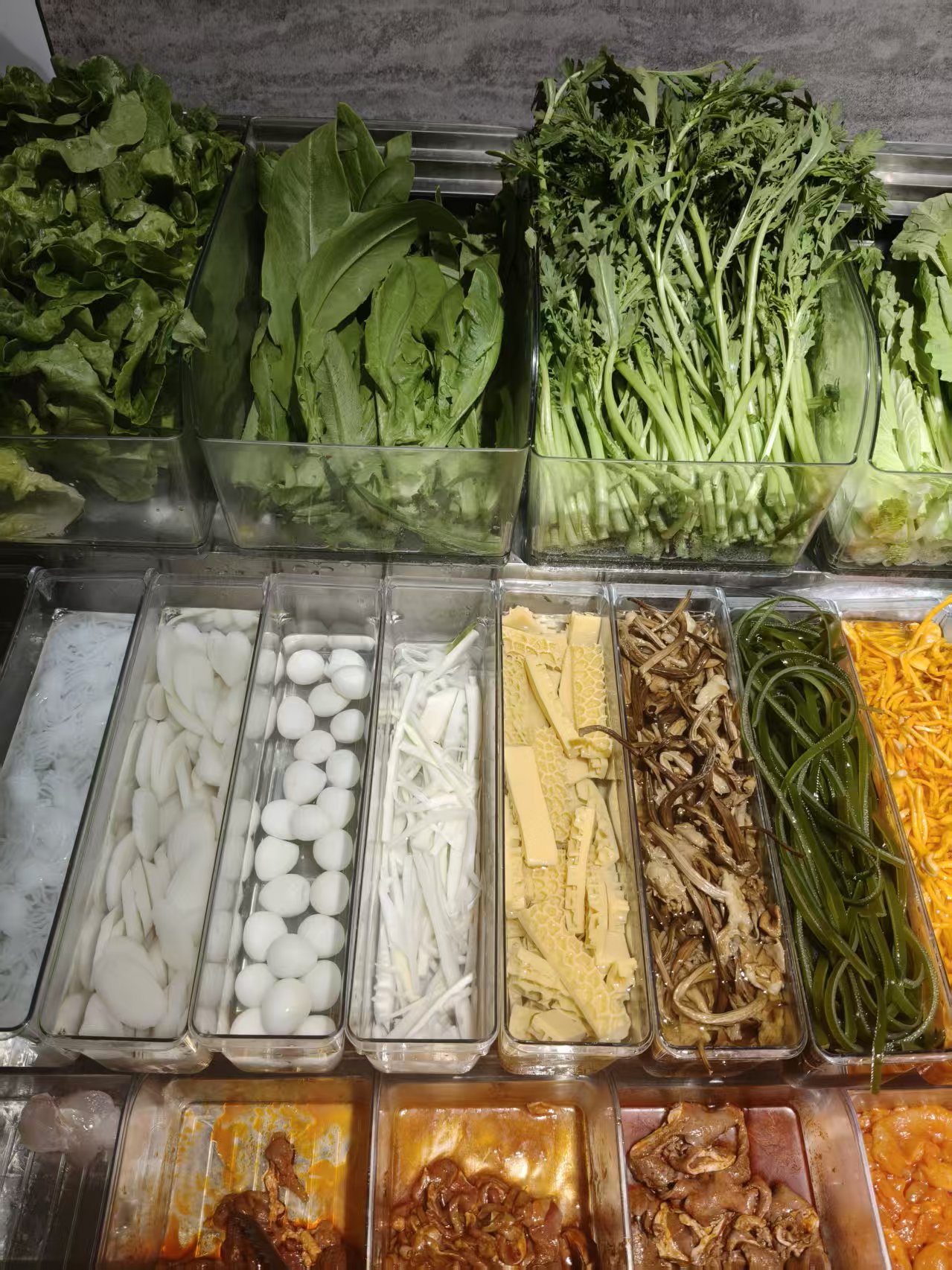 Ingredient display with greens, quail eggs and noodles